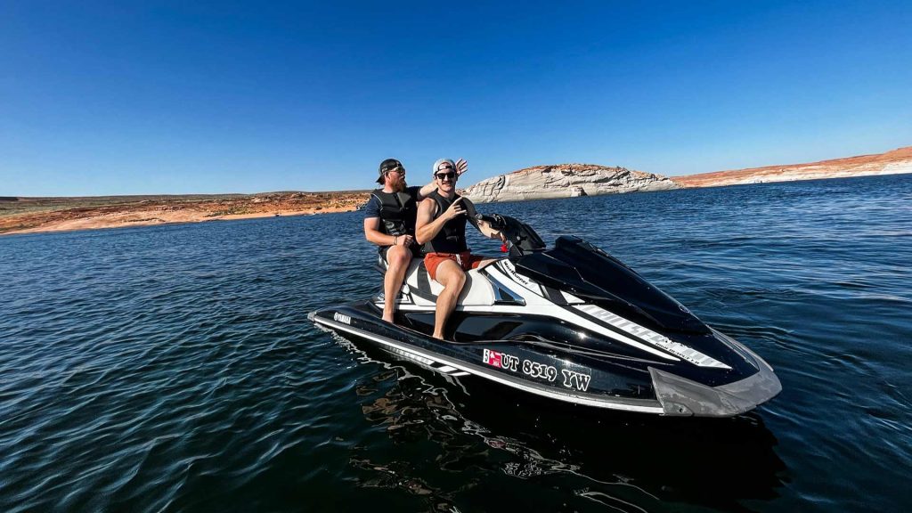 Wake Bros Rentals Lake Powell jet skis and other watercraft available for rent, set against the breathtaking scenery of the desert lake.