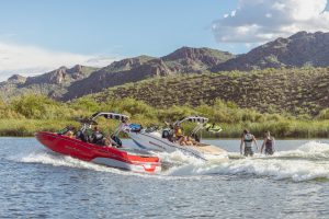 Thrill-seekers enjoying a ride on a MasterCraft boat, provided by Wake Bros Rentals.