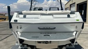 The AXIS T23 boat from Wake Bros Rentals, demonstrating its sleek design and powerful engine on a serene water body